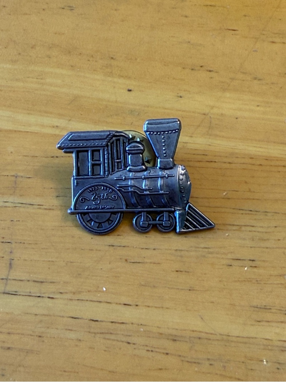 Steam locomotive lapel pin.